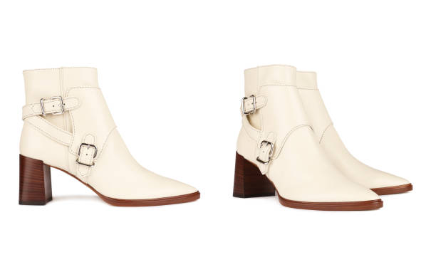 istock Women's white stylish boots. Front and side views 1332466466