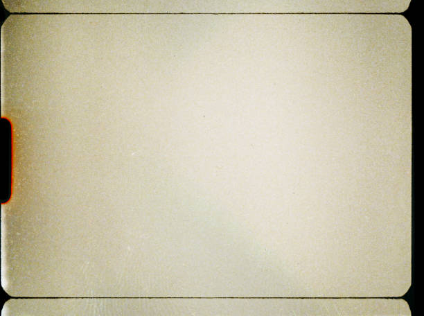istock scan of empty or blank cine film frame with dust and scratches. 1332466471