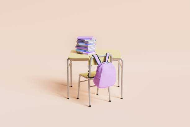 minimalne biurko szkolne pełne książek z różowym plecakiem wiszącym na krześle na pastelowym tle - desk education school student zdjęcia i obrazy z banku zdjęć