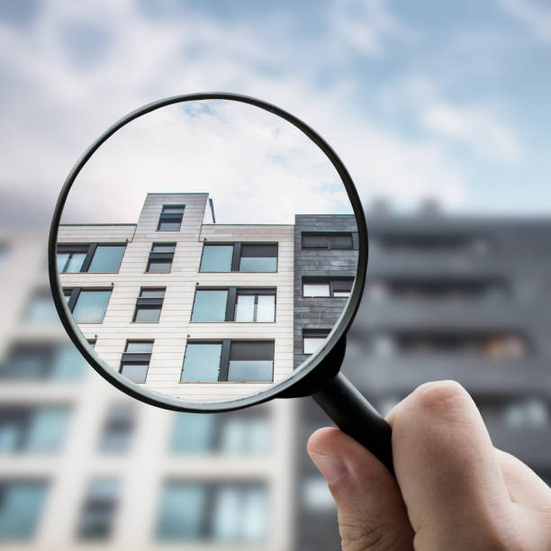 Magnifying glass focusing a modern apartment building facade