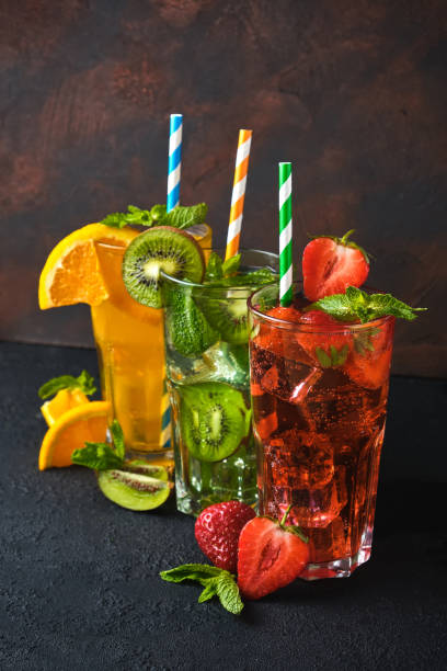 istock Three classic cocktail glasses on stone black table 1332472726