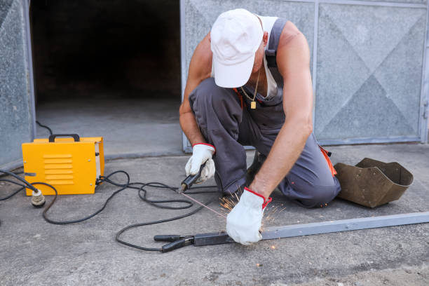 istock Metal worker repairing a pipe with welding torch 1332474044
