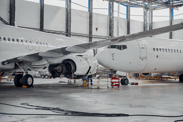istock Professional plane expluatation service in big hangar 1332475065