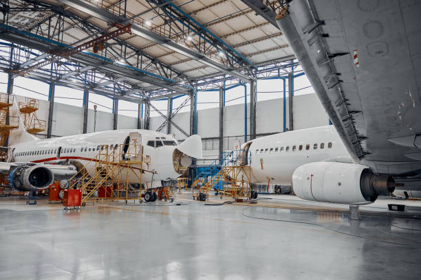 istock Professional plane expluatation service in big hangar 1332475067