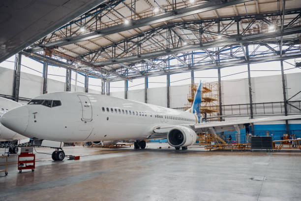 istock Professional plane expluatation service in big hangar 1332475068