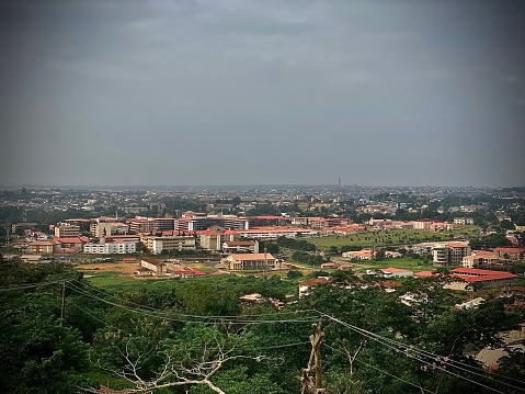 From a distance, one can see modern structures not too far away from the brown roofed areas of the city of Ibadan.