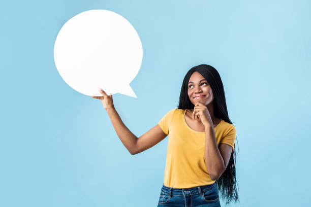 istock Black Lady Thinking Holding Speech Bubble Above Head, Blue Background 1332476656