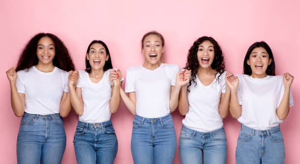 istock Excited Millennial Women Holding Hands Over Pink Background, Panorama 1332476732