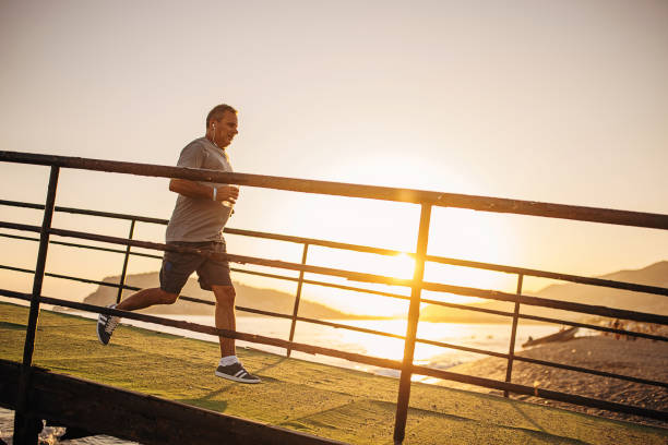 istock Senior man jogging on a pier 1332478092