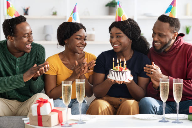 istock Happy black youngsters celebrating birthday at home 1332478212