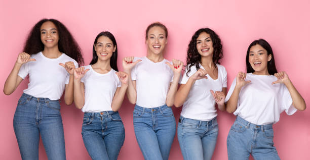 istock Five Multiethnic Women Pointing Thumbs At Themselves, Pink Background, Panorama 1332478241