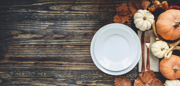istock Thanksgiving Banner of Empty Place Setting with Decor 1332478680