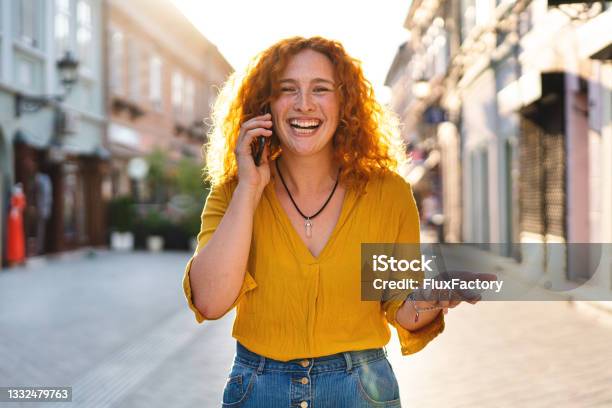 Adorbale Modern Young Woman Cant Hide Her Excitment After She Recieved An Amazing News Via Mobile Phone Call Stock Photo - Download Image Now