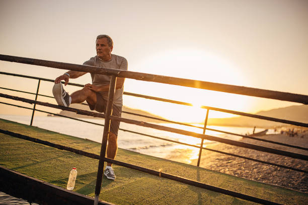 istock Senior man exercising on a pier 1332480985