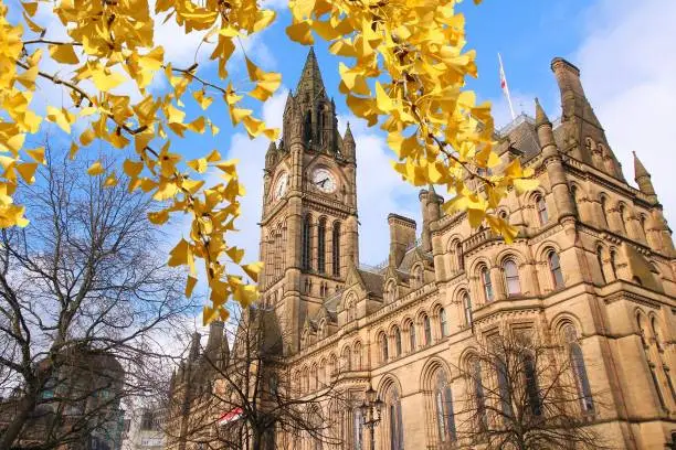Manchester - city in North West England (UK). City Hall.- Autumn leaves - autumn season view.
