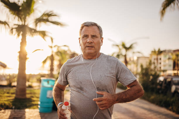 istock Senior man running on the sidewalk 1332482281