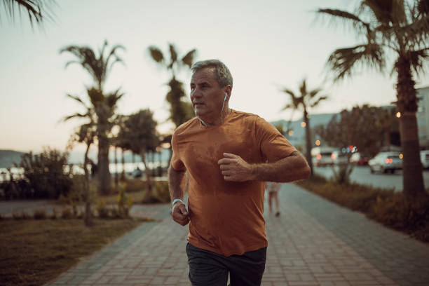 istock Senior man jogging on the sidewalk 1332482298
