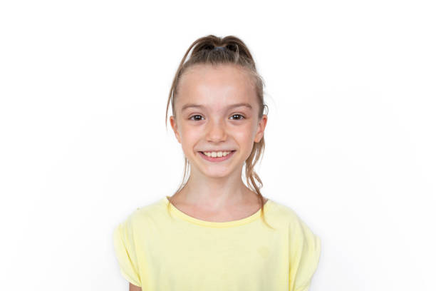 Happy girl standing, smiling isolated on white studio background