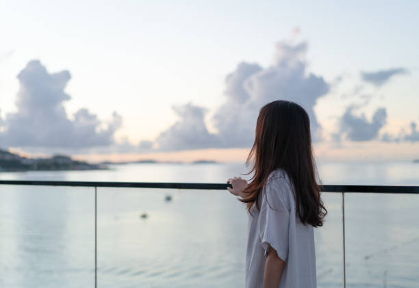 istock woman standing on balcony 1332485186