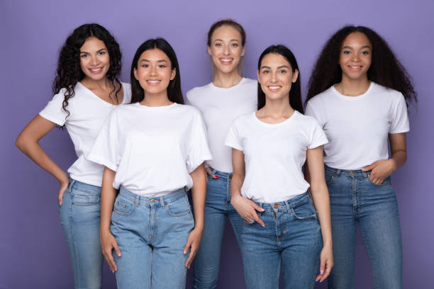 istock Pretty Diverse Women Standing Over Purple Studio Background 1332485327