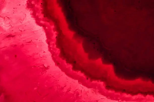 Close-up textured pink red background gemstone