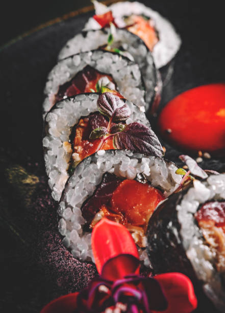 istock sushi roll in plate on wooden table background 1332487865