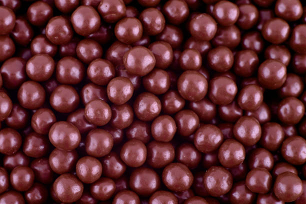 istock Chocolate candies abstract background, copy space. Sweets abstract texture. Top view, flat lay 1332487888