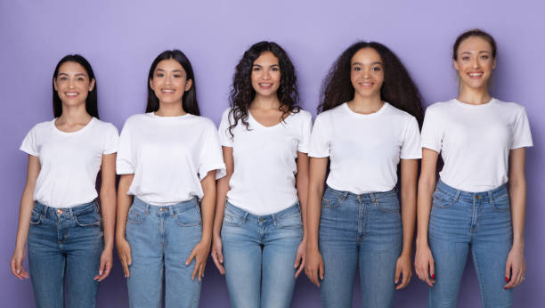 istock Multicultural Young Ladies Standing Together Over Purple Background 1332487972