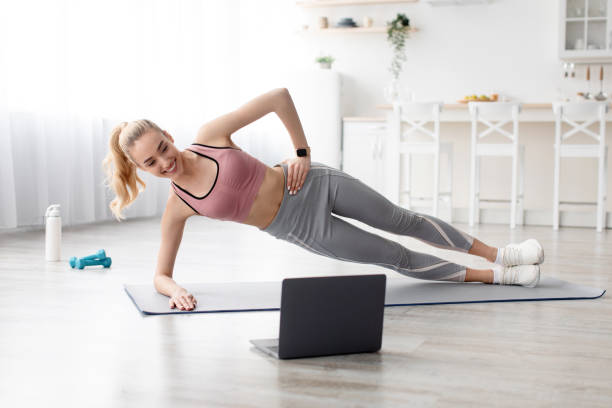 istock Covid-19 lockdown, online trainer, modern lesson and workout at home at morning 1332488059