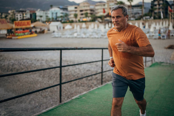 istock Senior male jogging alone on a pier 1332488067