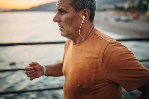 istock Senior male jogging alone on a pier 1332488102