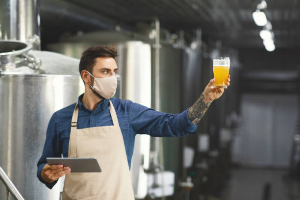 istock Beverage quality control, beer assessment and work at plant during COVID-19 outbreak 1332489820