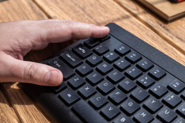 istock Hands Pointing Pressing Computer Keyboard Keys Typewriting New Ideas. Fingers Tapping Typing Fresh Thoughts Using Wireless Notebook Keypad. 1332490024
