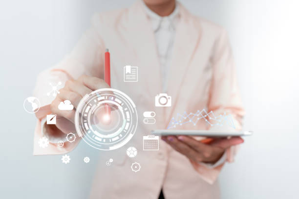 istock Business Woman Touching Digital Data On Holographic Screen Interface. Lady In Uniform Holding Mobile Device And Presenting Different Futuristic Virtual Display Diagrams. 1332490026