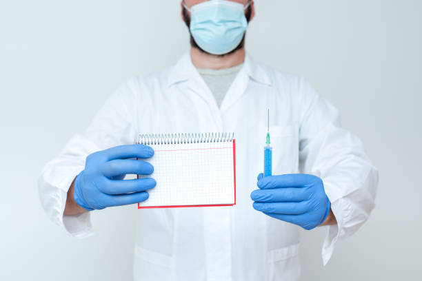 istock Researcher Displaying Virus Prevention Method, New Infection Cure Ideas, Explaining Scientific Problems, Laboratory Experimentation, Medical Treatment Plans 1332490097