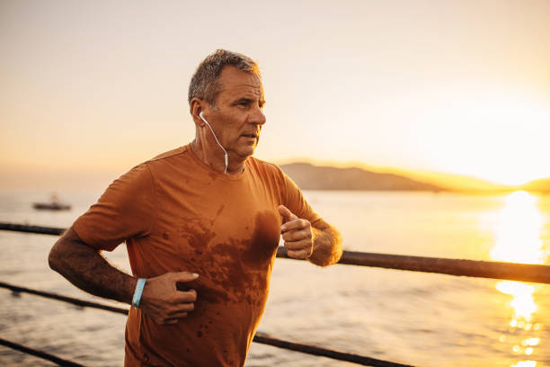 istock Senior male jogging on a pier 1332494970