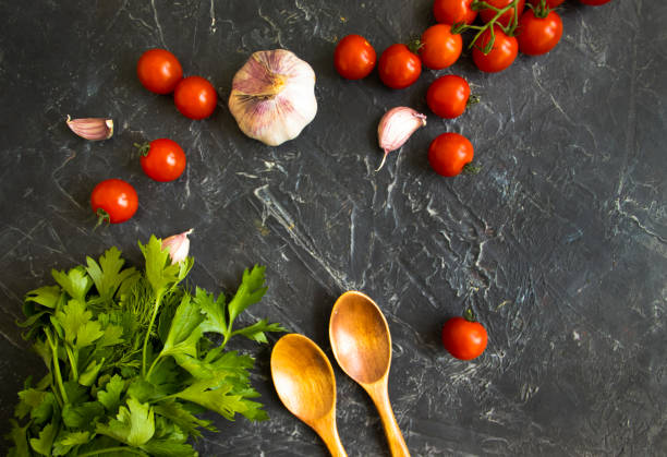 istock tomato, garlic, parsley on a concrete background 1332497530