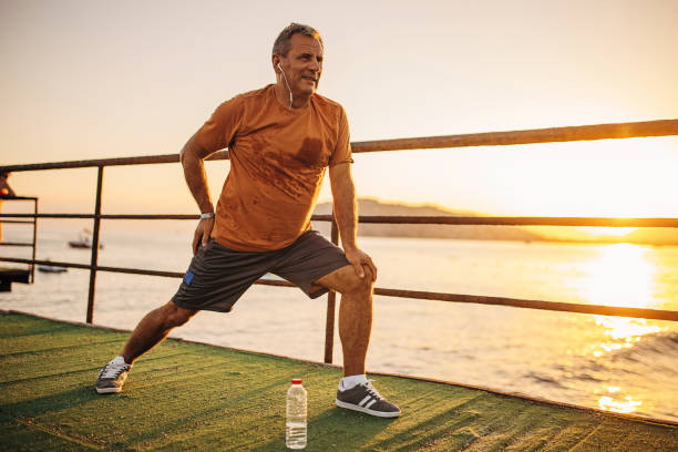 istock Senior man exercising on a pier 1332499321