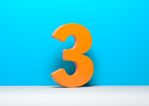 Orange-colored number three. On blue and white-colored background. Horizontal composition with copy space. Isolated with clipping path