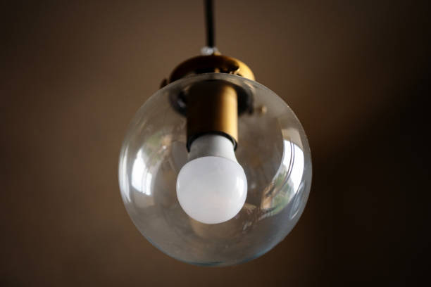 istock Glass ceiling Lamp with white light bulb 1332499974