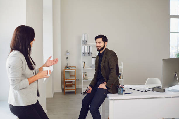 istock Business people talking in a white office. 1332500655