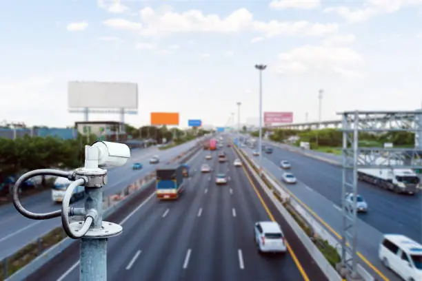 CCTV cameras on the overpass for recording on the road for safety and traffic violations.
