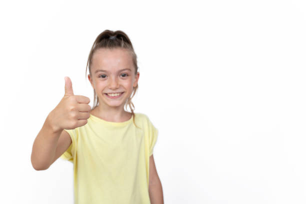 istock Young beautiful girl over isolated background approving doing positive gesture with hand, thumbs up smiling and happy for success 1332502308