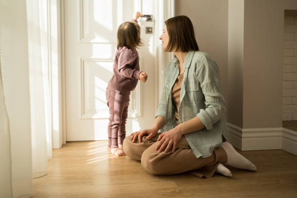 istock Girl with down syndrome touching to handle while spending time with her mother 1332503042