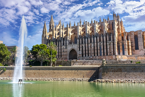 Cathedral of the city of Palma de Mallorca with blue sky and clouds.