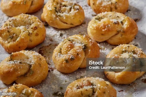 Soft And Chewy Parmesan Garlic Knots Stock Photo - Download Image Now - Garlic, Tied Knot, Rolled Up