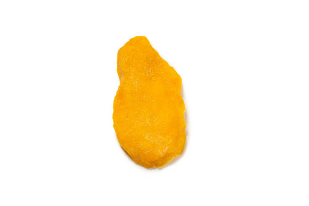istock Dry tasty mango slices isolated on a white background. 1332505804