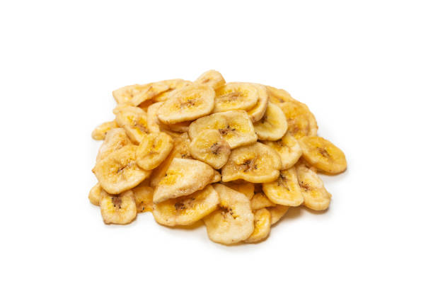 istock Banana chips isolated on a white background. Dehydrated banana. 1332505818