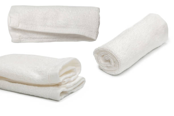 istock White fluffy cotton towel isolated on a white background. 1332505858