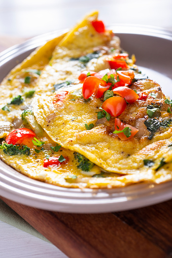 Homemade Vegetable Omelet with Tomato, Broccoli, Spinach, Onion and Red Bell Pepper